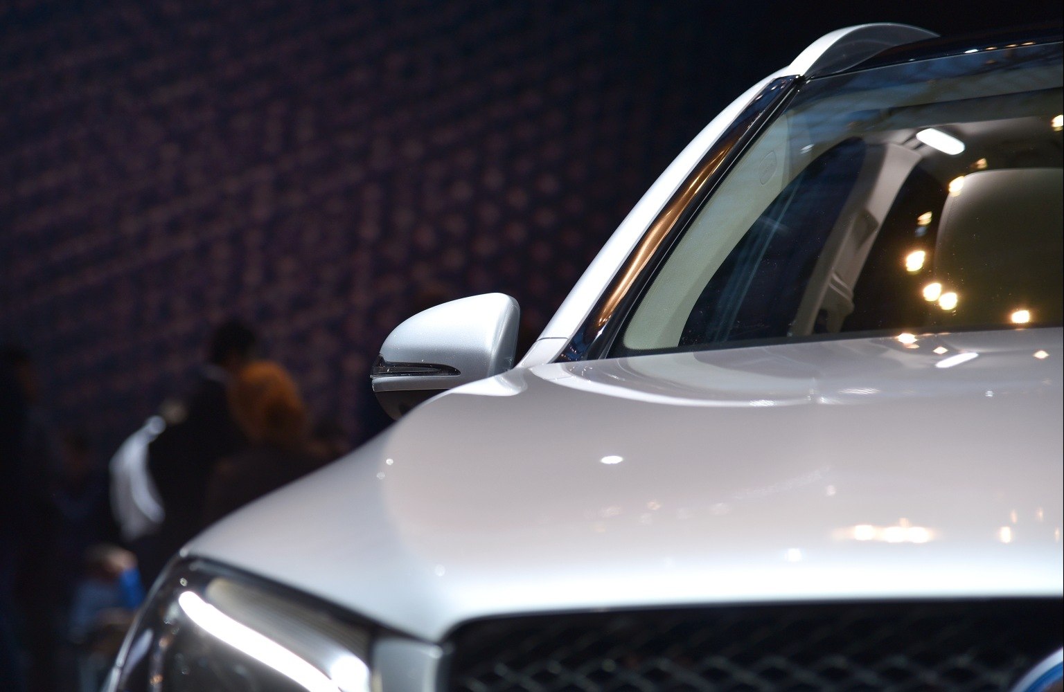 Close-up of side mirror and front hood with sleek design