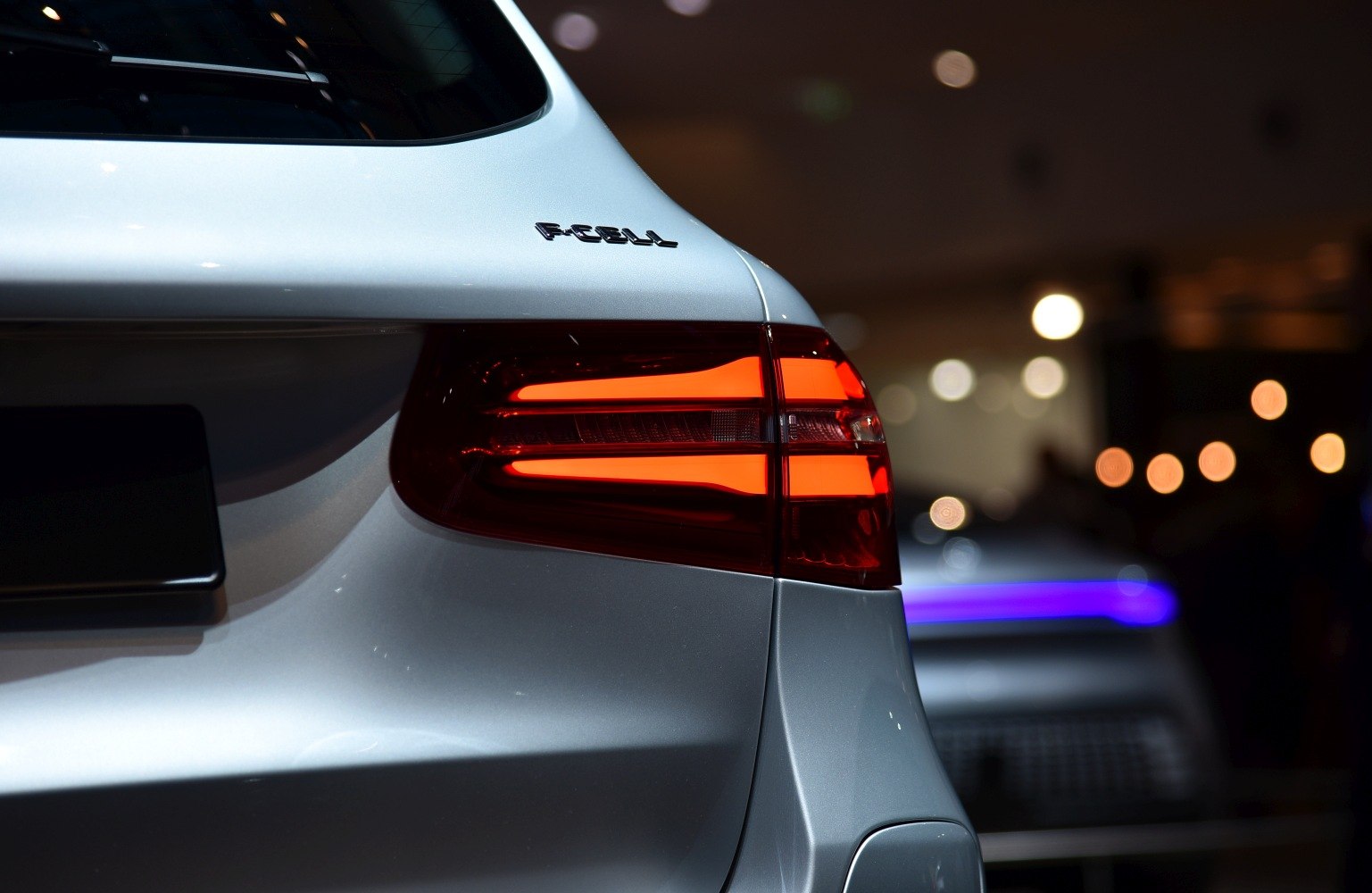 Illuminated modern luxury SUV tail light and rear panel design