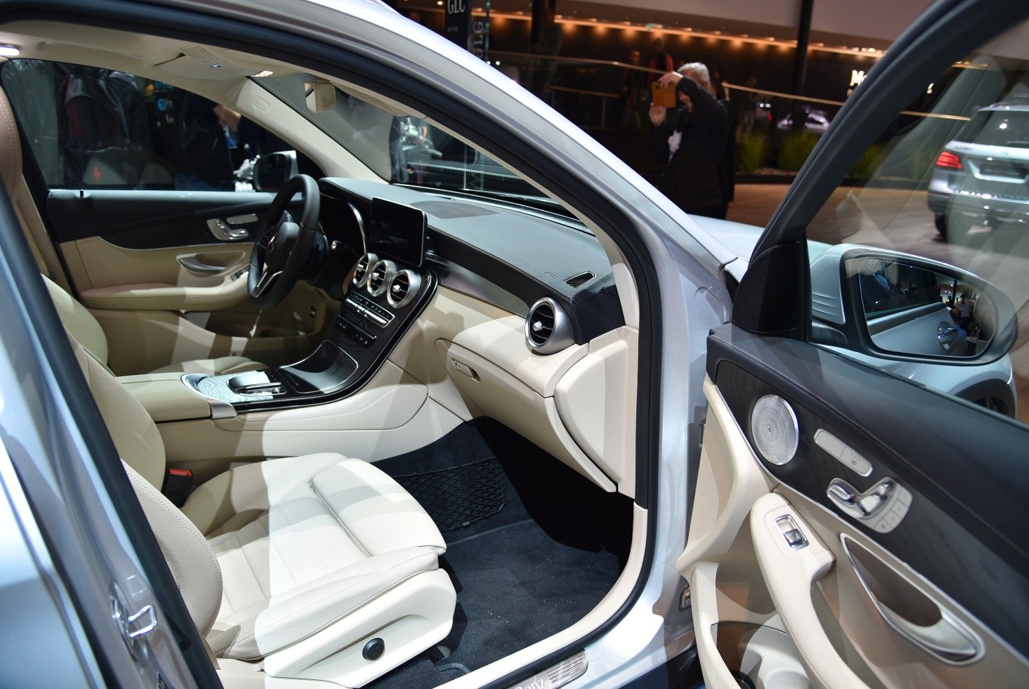 Beige leather interior with modern dashboard and circular air vents