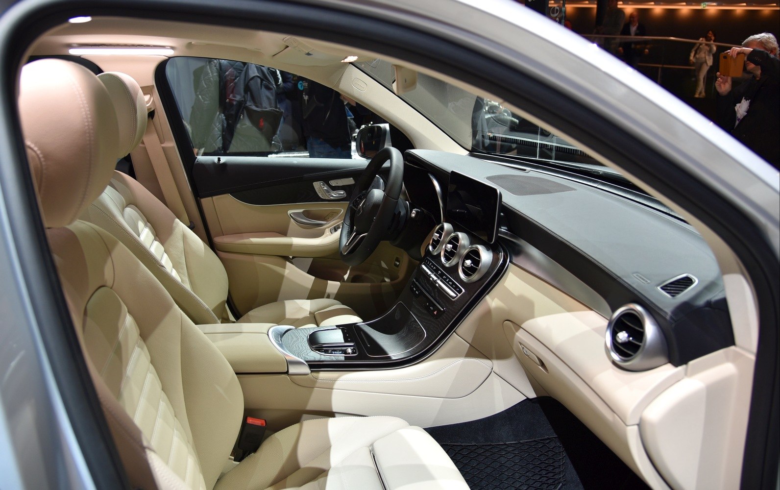 Beige leather seats and modern dashboard with circular air vents