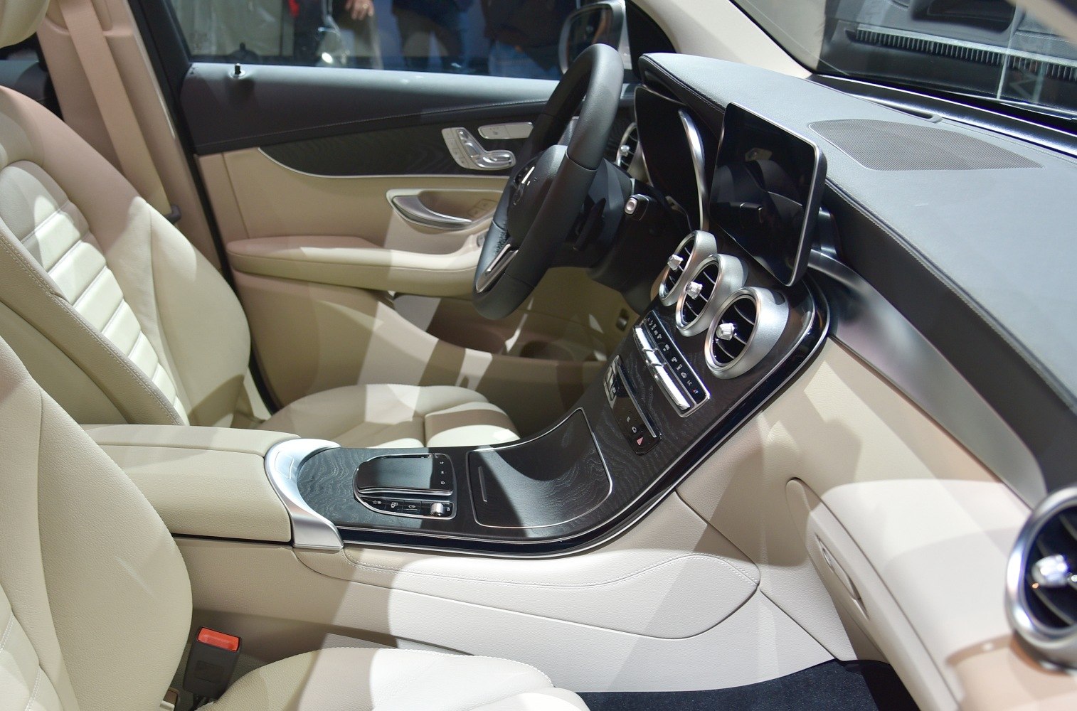 Beige leather seats and central console with touchscreen and air vents