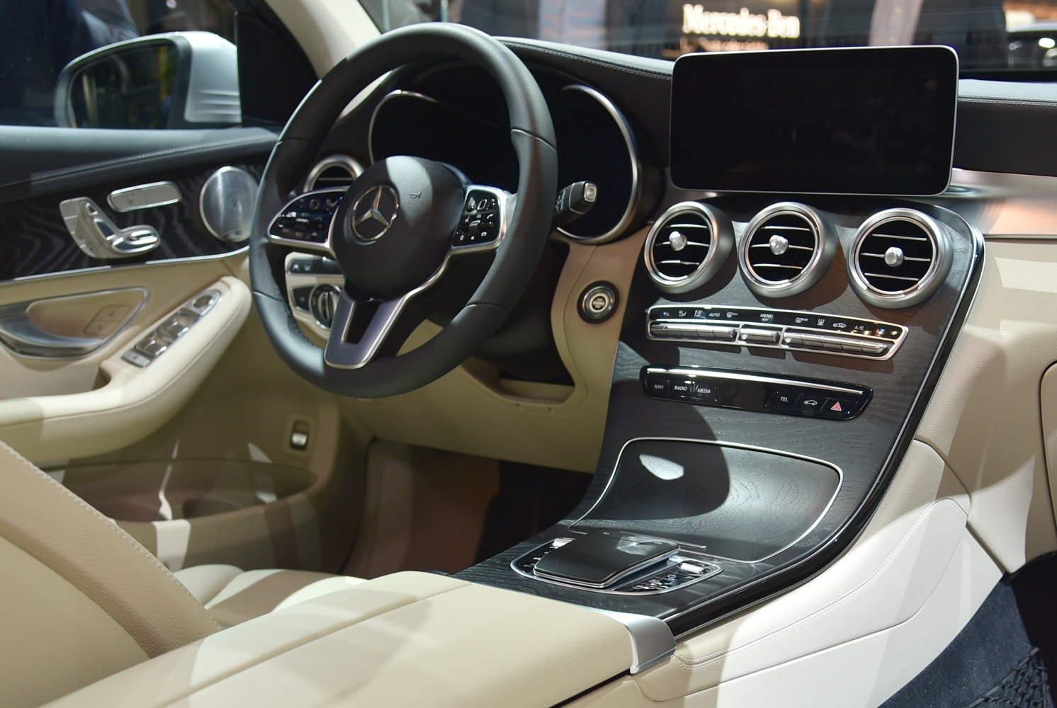 Luxury SUV interior with multifunction steering wheel and modern dashboard layout