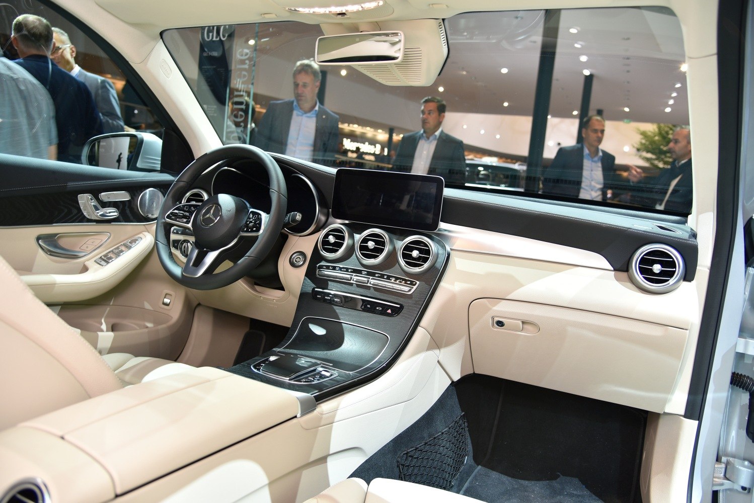 Modern luxury dashboard and beige interior with central display