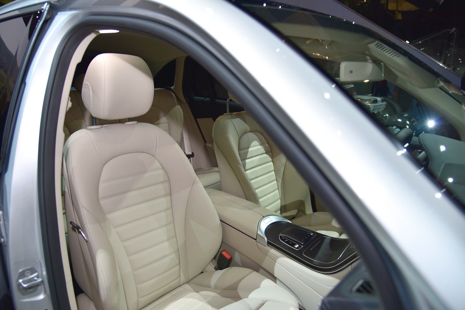 Beige leather seats and modern center console design in SUV interior