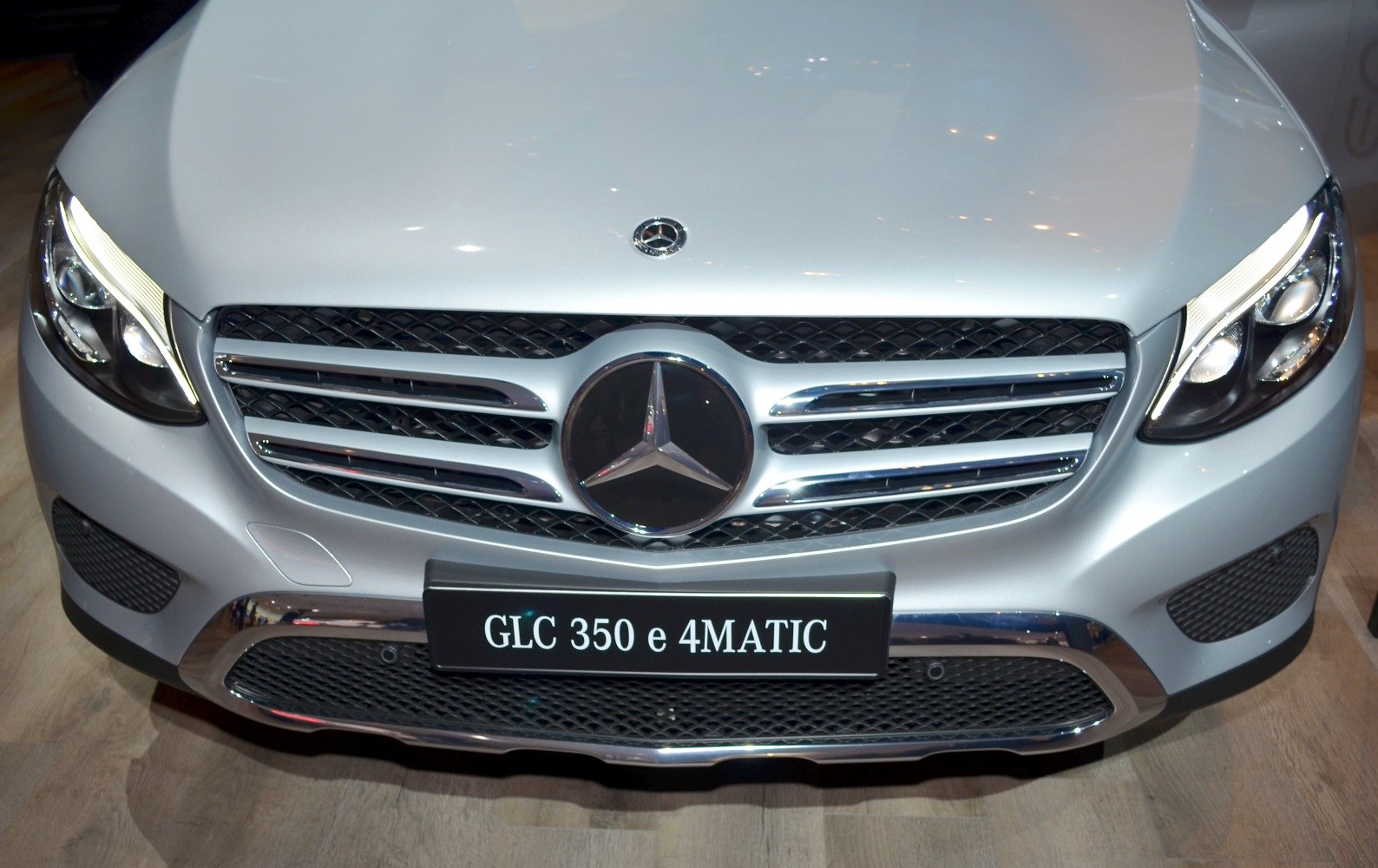 Front grille with Mercedes-Benz emblem and LED headlight close-up