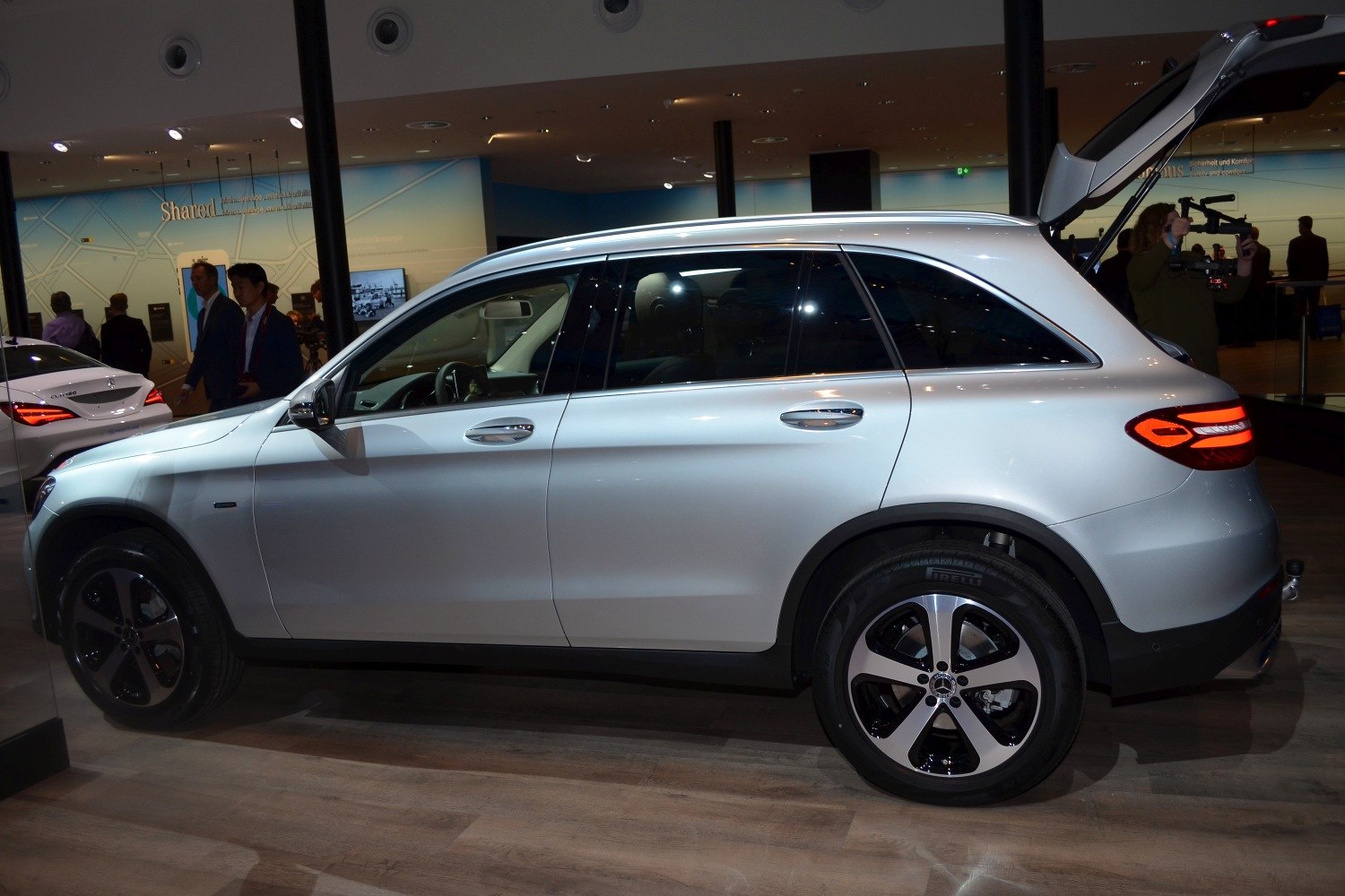 Side profile with rear hatch open and alloy wheels