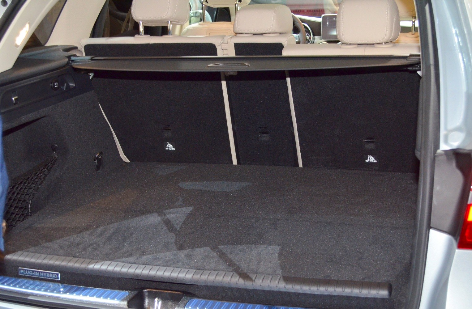 Spacious rear cargo area with foldable rear seats and protective cover