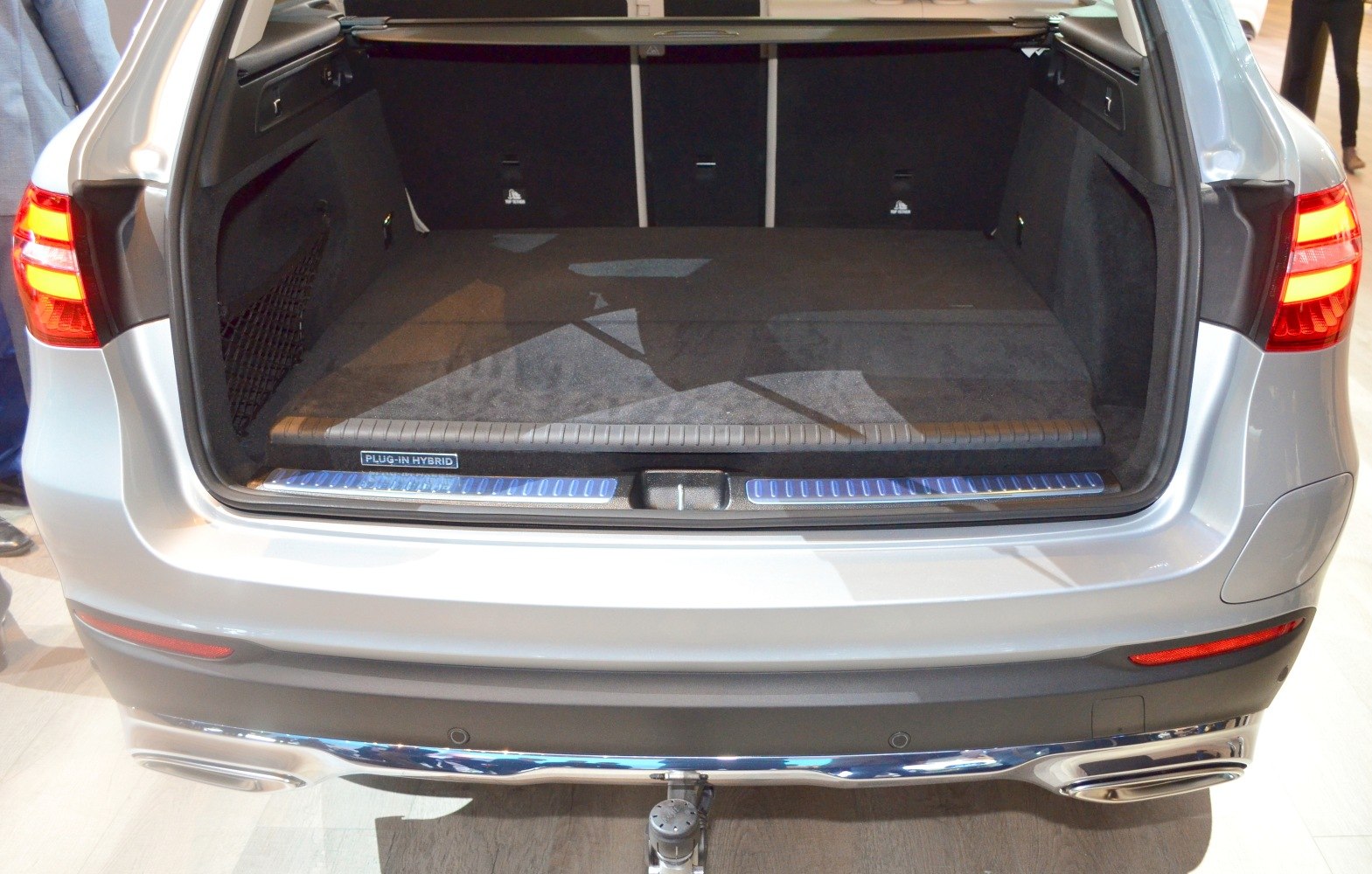 Spacious rear cargo area with plug-in hybrid badge and modern taillights