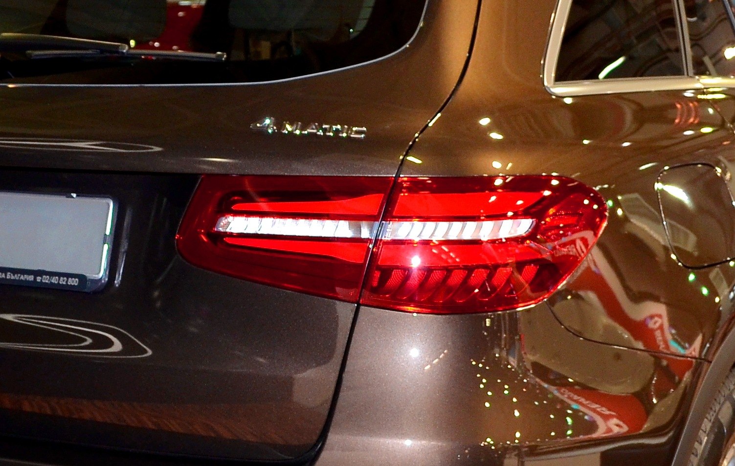 Rear LED tail light and 4MATIC badge on SUV's back quarter panel