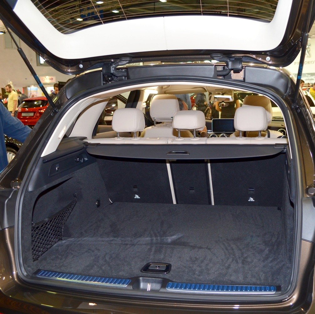 Spacious cargo area with retractable cover and rear seats in luxury SUV