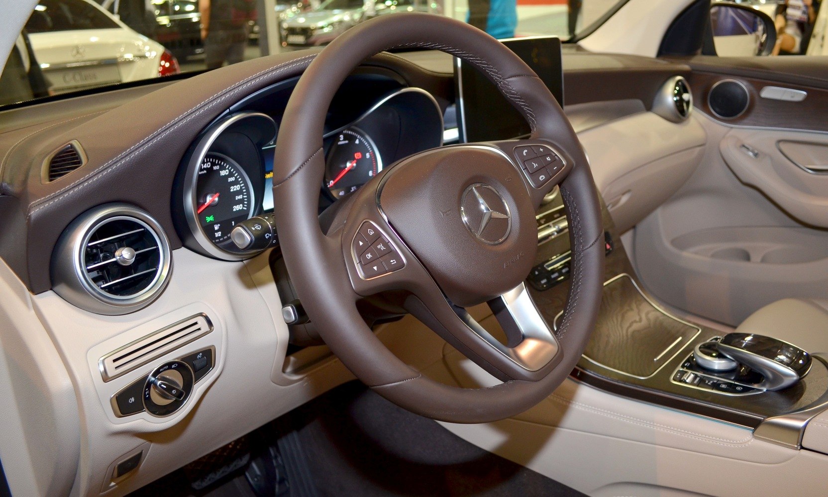 Luxury steering wheel and dashboard interior with center console controls