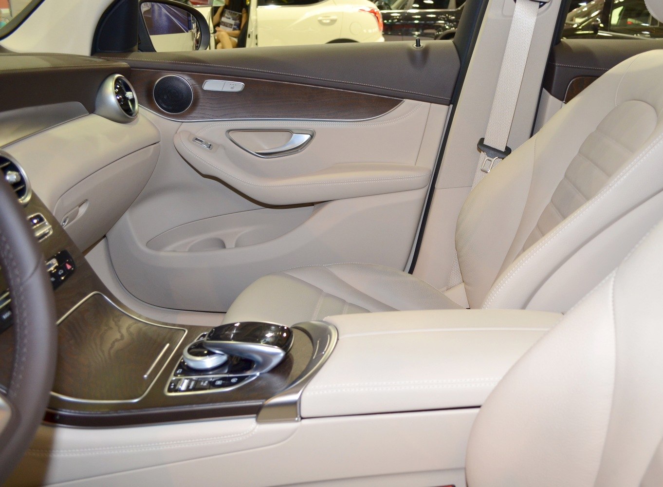 Refined SUV interior with wood trim and beige leather upholstery