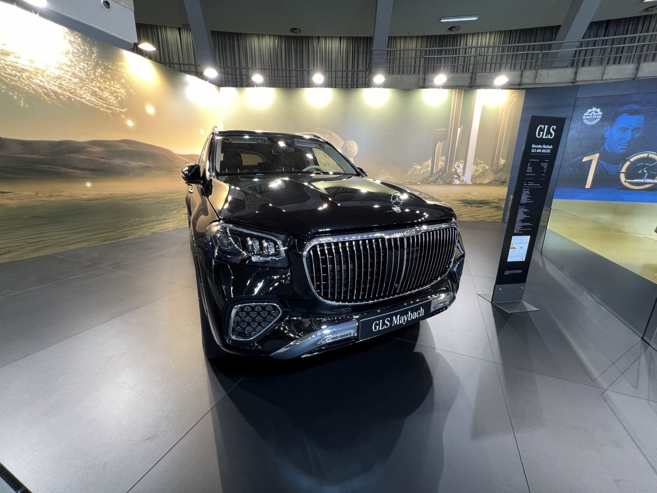 Front view of luxury SUV with prominent grille and LED lights.