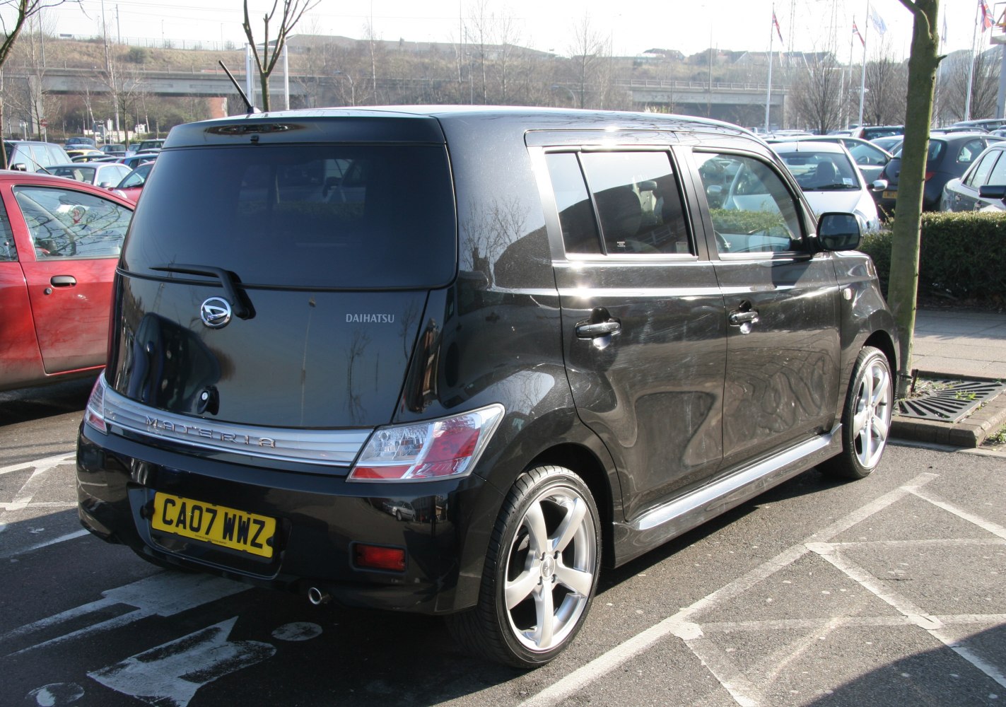 Rear and side view with tinted rear window and alloy wheels