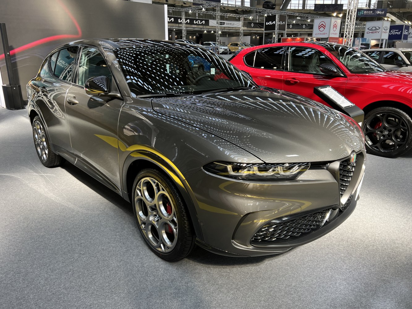 Front side view of vehicle with sharp LED headlights and unique alloy wheels