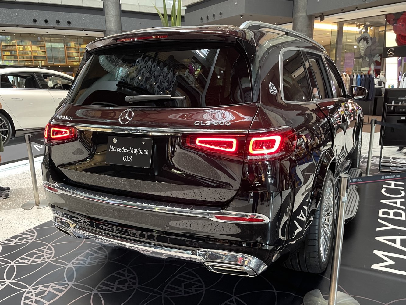 Rear view of a luxury SUV with LED taillights and chrome exhaust tips