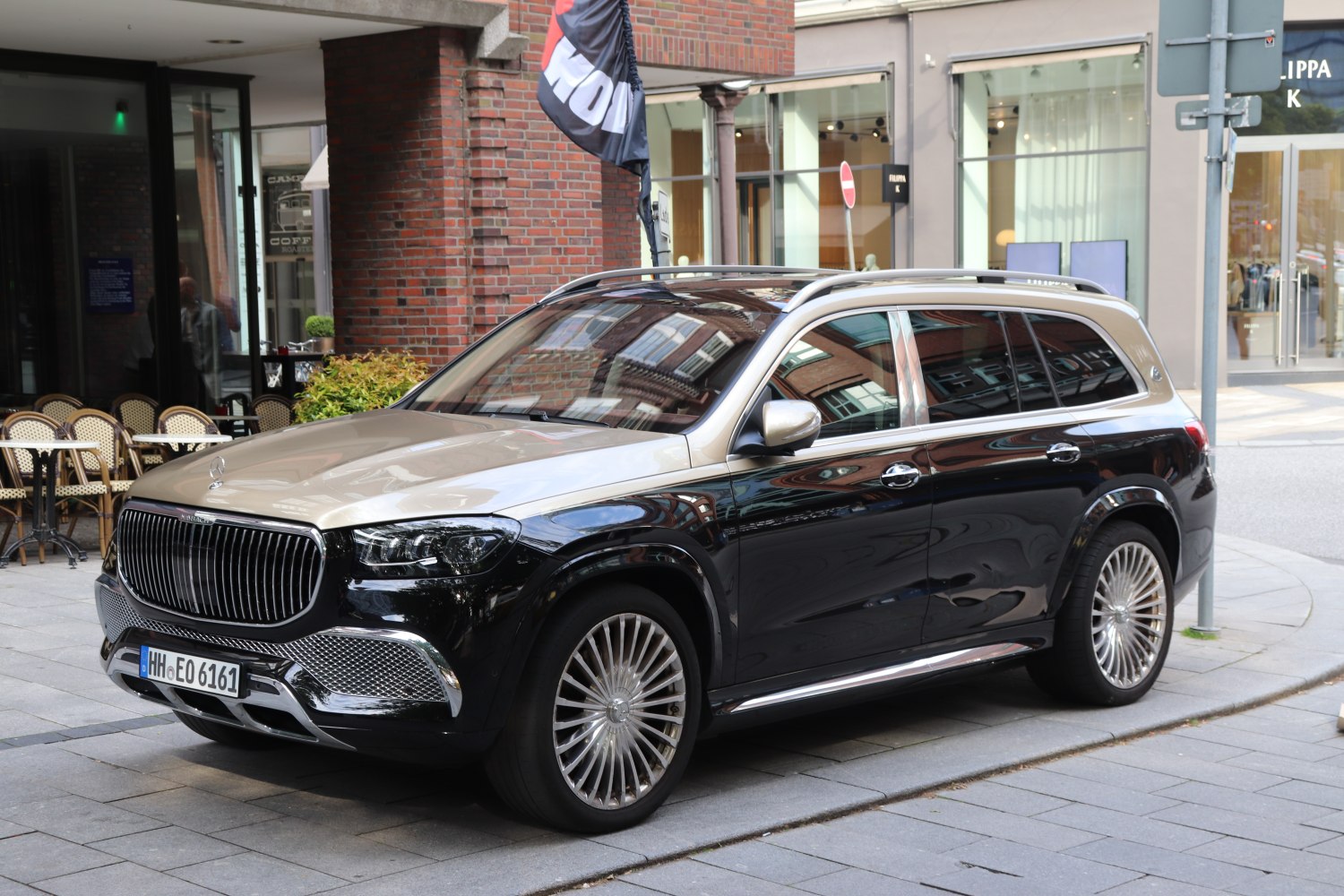 Two-tone SUV with vertical slat grille and multi-spoke alloy wheels