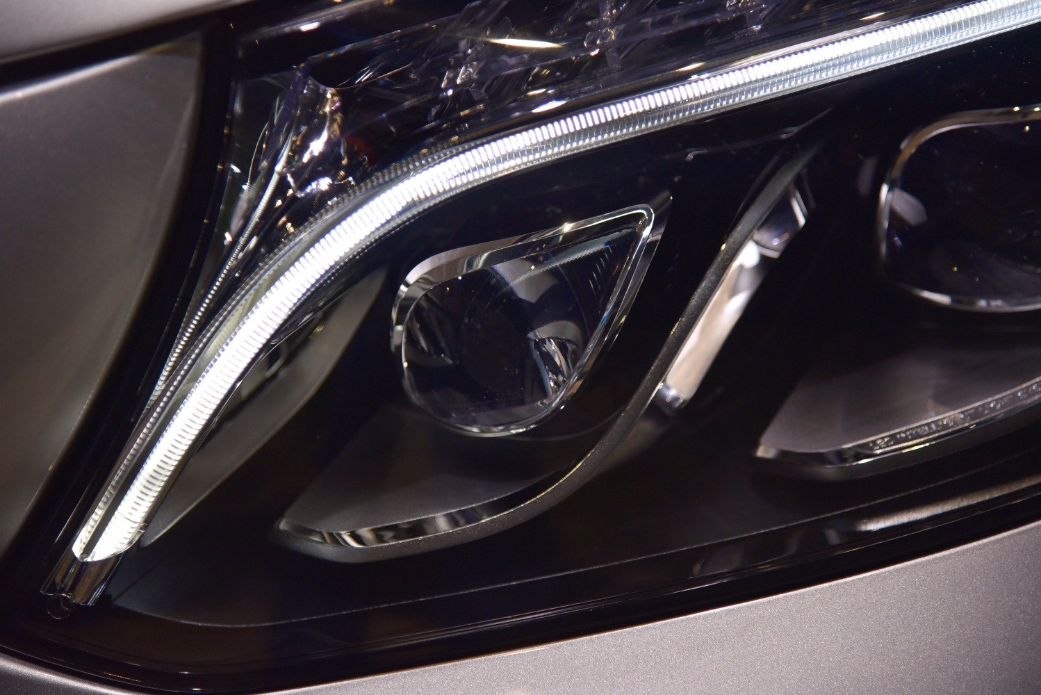 Close-up of a modern LED strip headlight assembly.