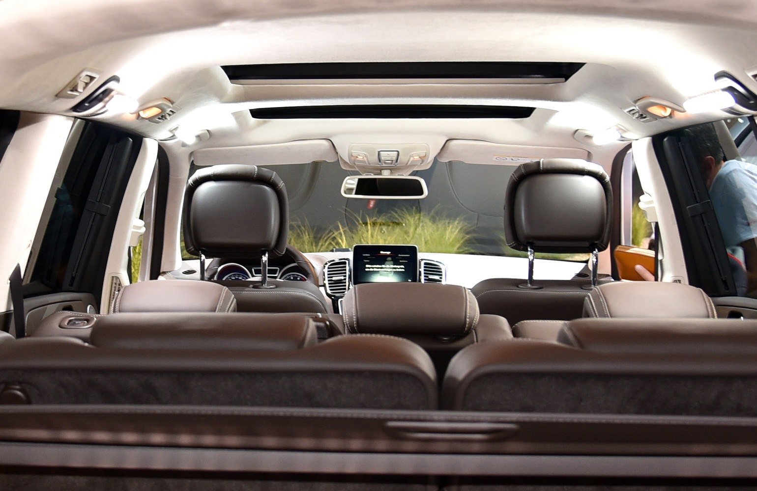 Panoramic sunroof and brown leather seats interior view