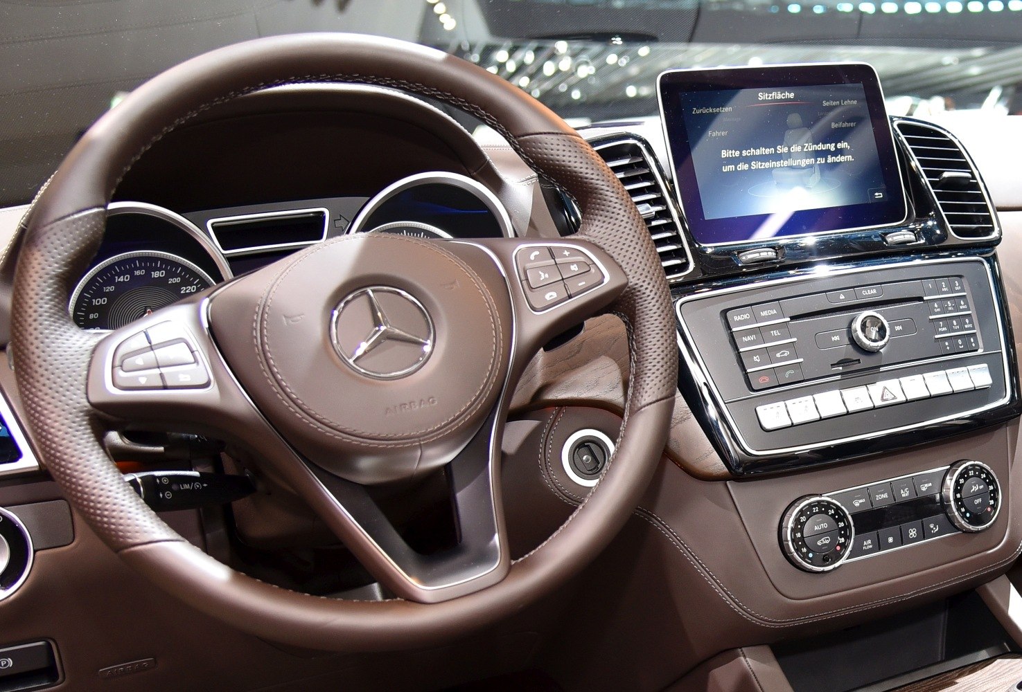 Luxury SUV steering wheel with digital display and control panel