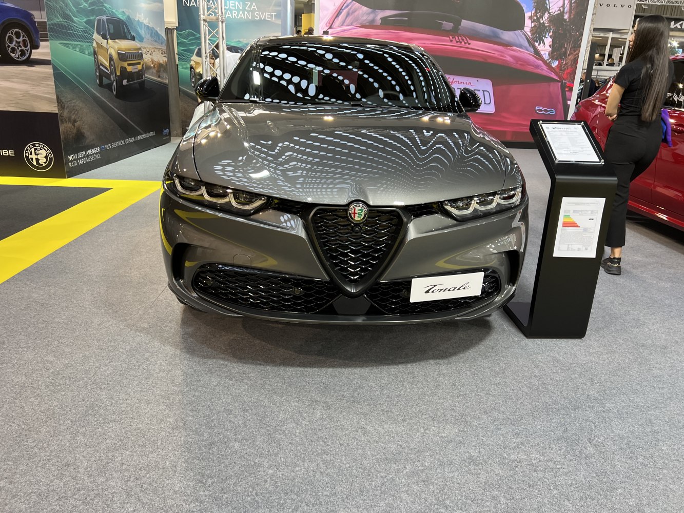 Front view with V-shaped grille and triple headlights