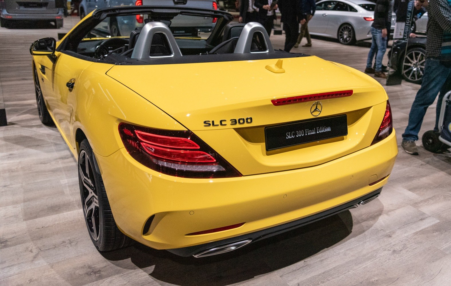 Yellow convertible rear with tail lights and dual exhausts