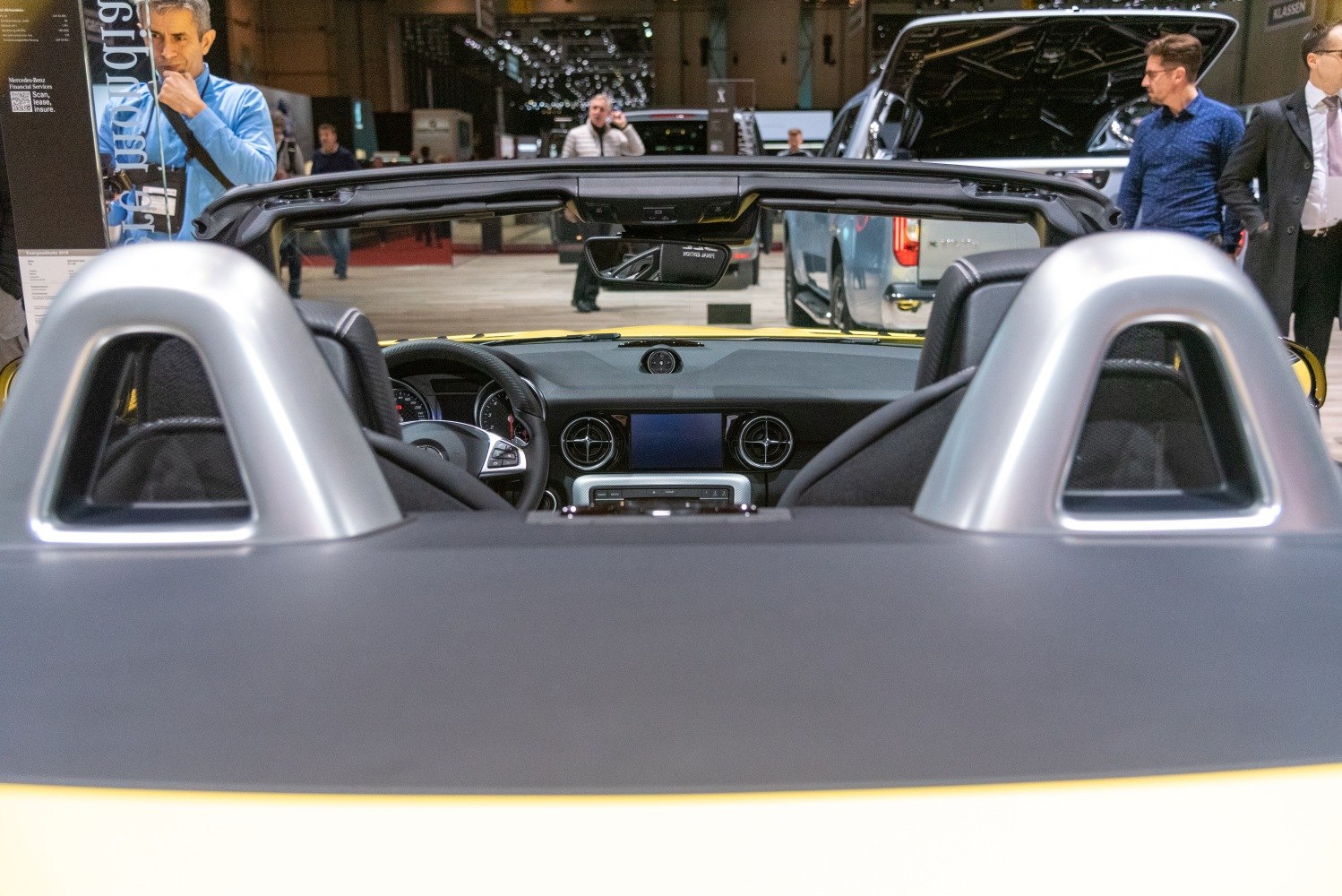Convertible interior with prominent roll bars and dashboard features.