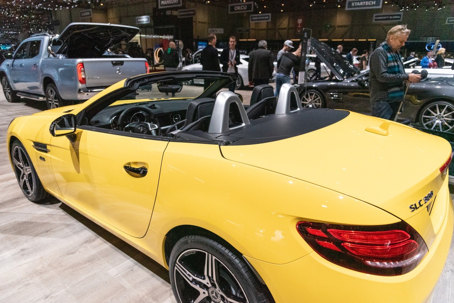 Yellow convertible roadster with sporty rear design and alloy wheels