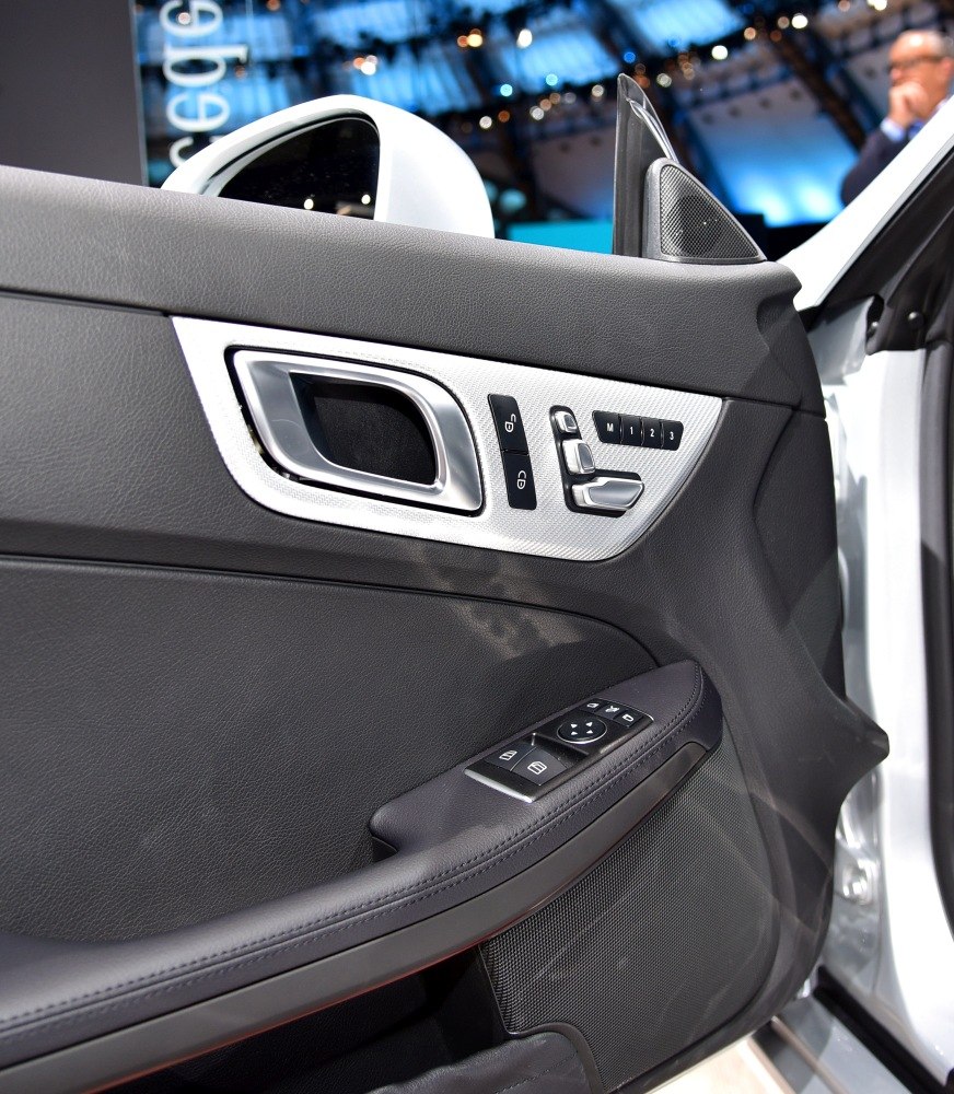 Door interior panel with control buttons and handle