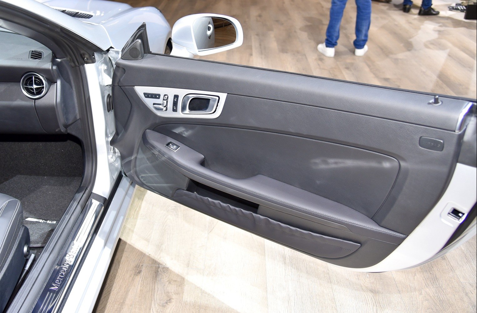 Interior door panel with controls and design details