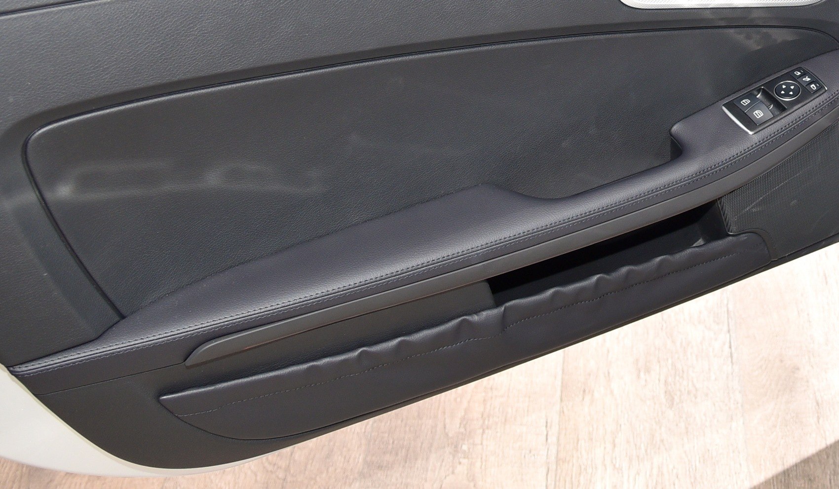 Interior door panel with window control buttons