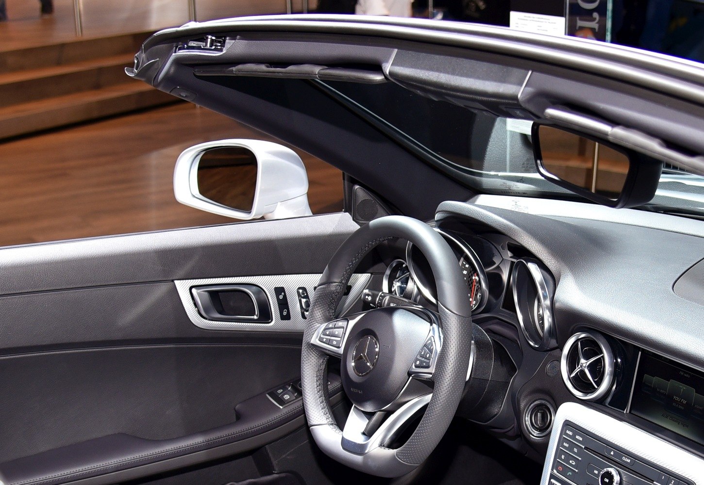 Steering wheel, door controls, dashboard, and interior trim details