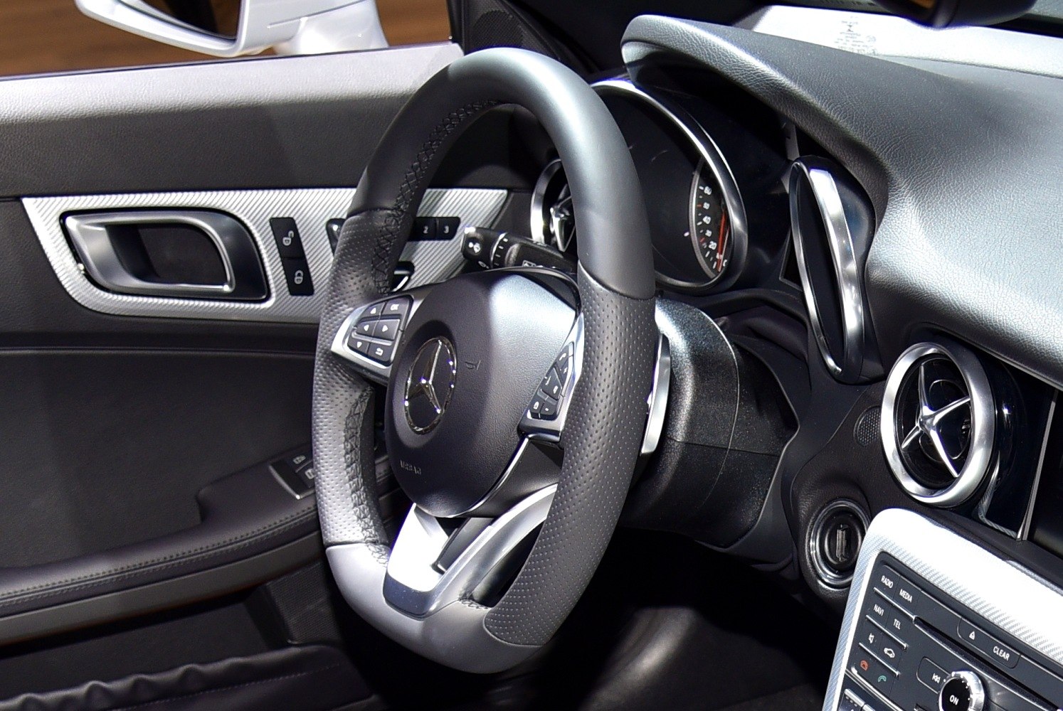 Close-up of steering wheel and dashboard controls
