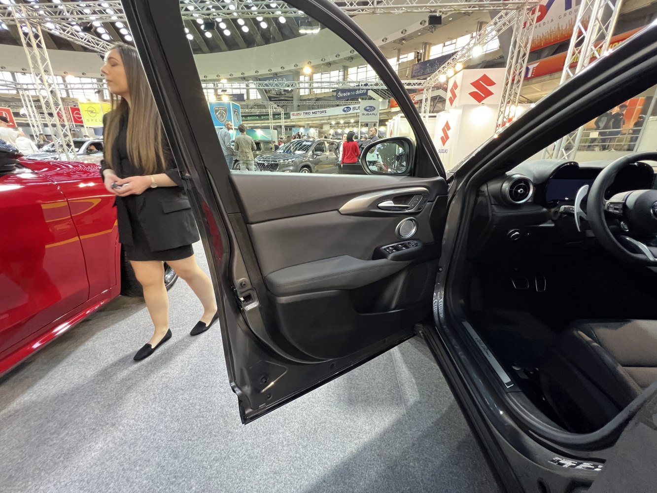 Interior door panel and dashboard with controls and circular air vent