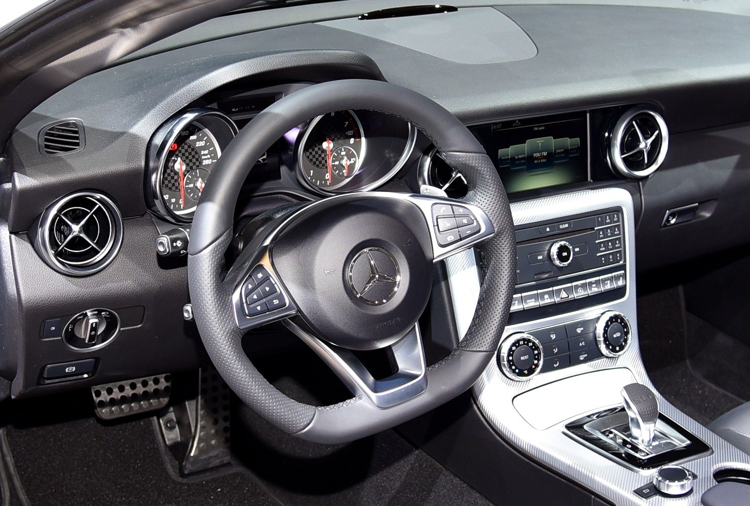 Modern luxury steering wheel and dashboard with digital displays