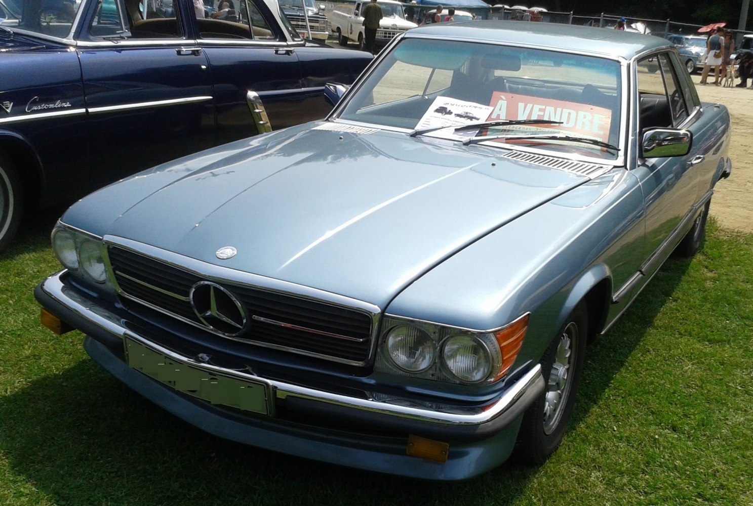 Front view of classic vintage coupe with twin headlights and iconic grille