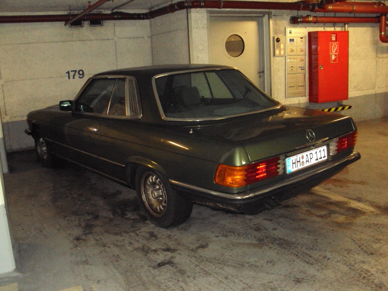 Vintage hardtop coupe rear view with detailed wheels