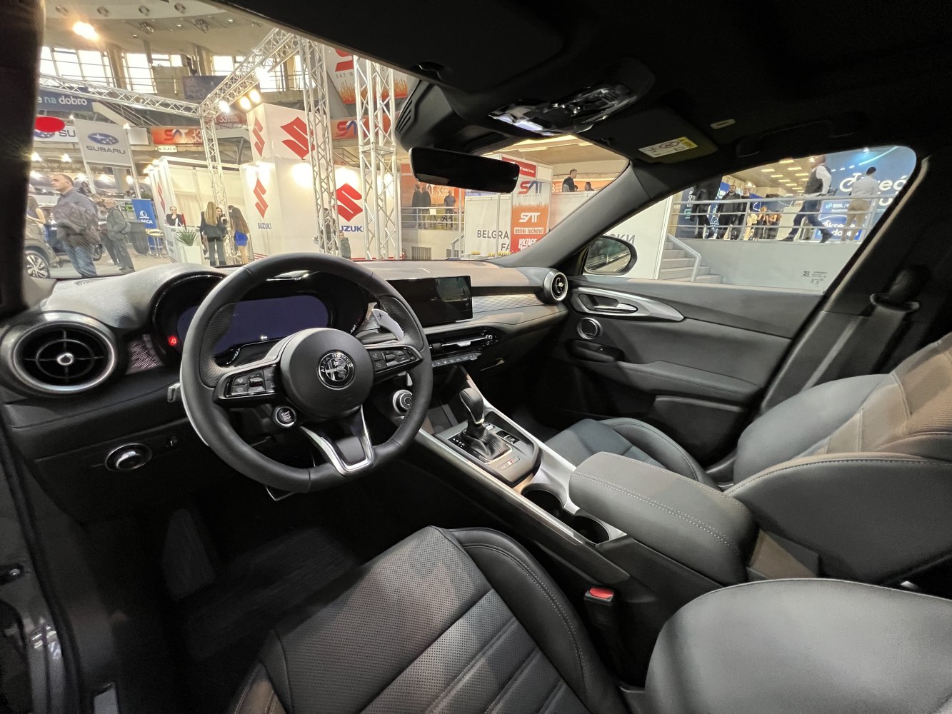 Modern car interior with dashboard, steering wheel, and gear shift