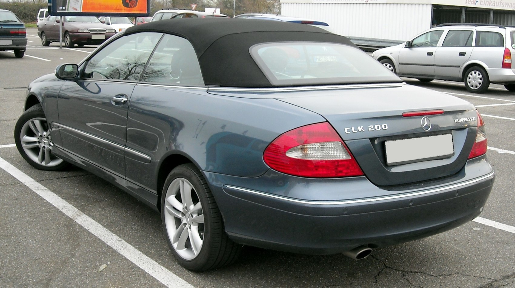 Rear view of a convertible with soft top and distinctive taillights