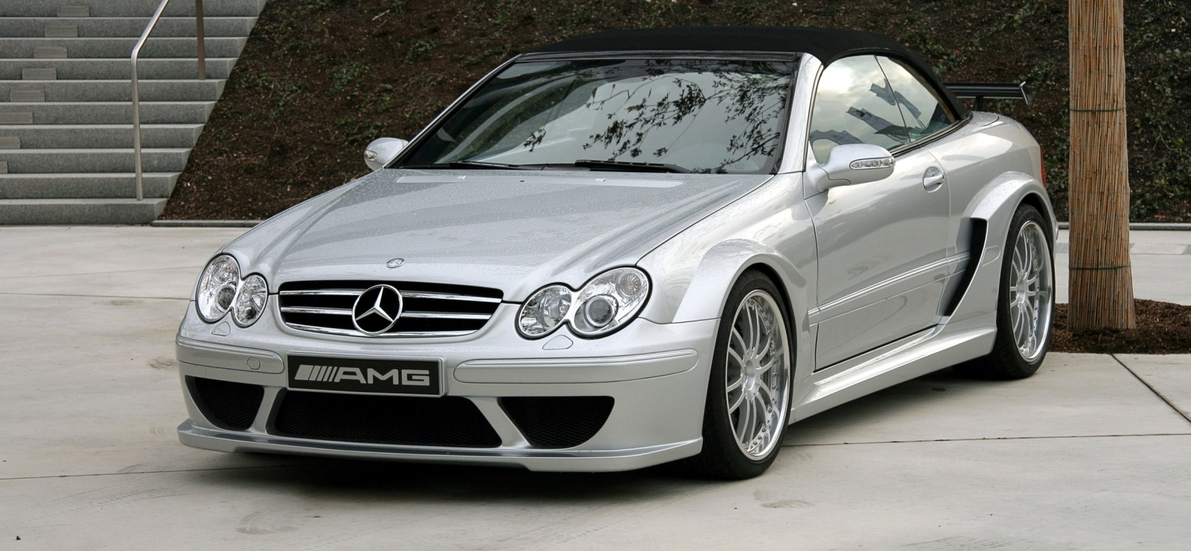 Front view of silver convertible with AMG styling and distinctive headlights