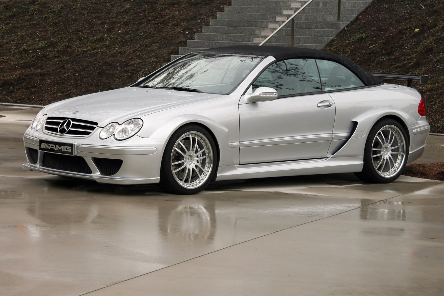 Silver AMG convertible with soft top and aerodynamic body kit