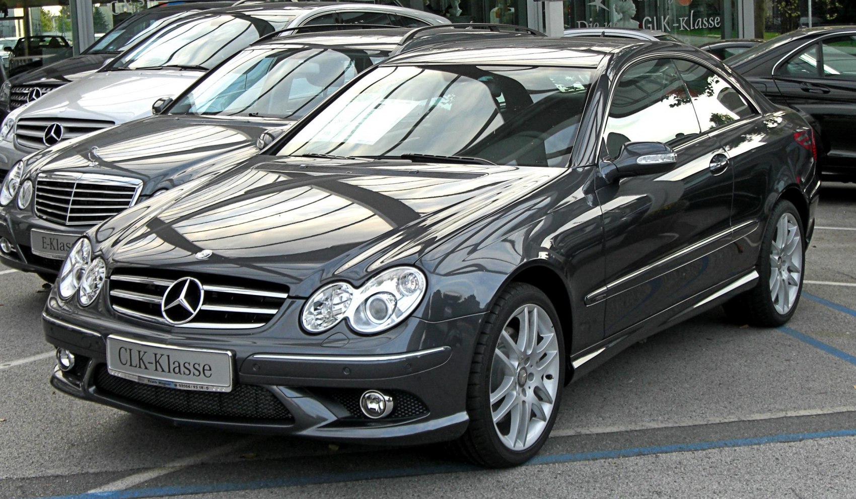 Front side view with dual headlights and distinctive grille