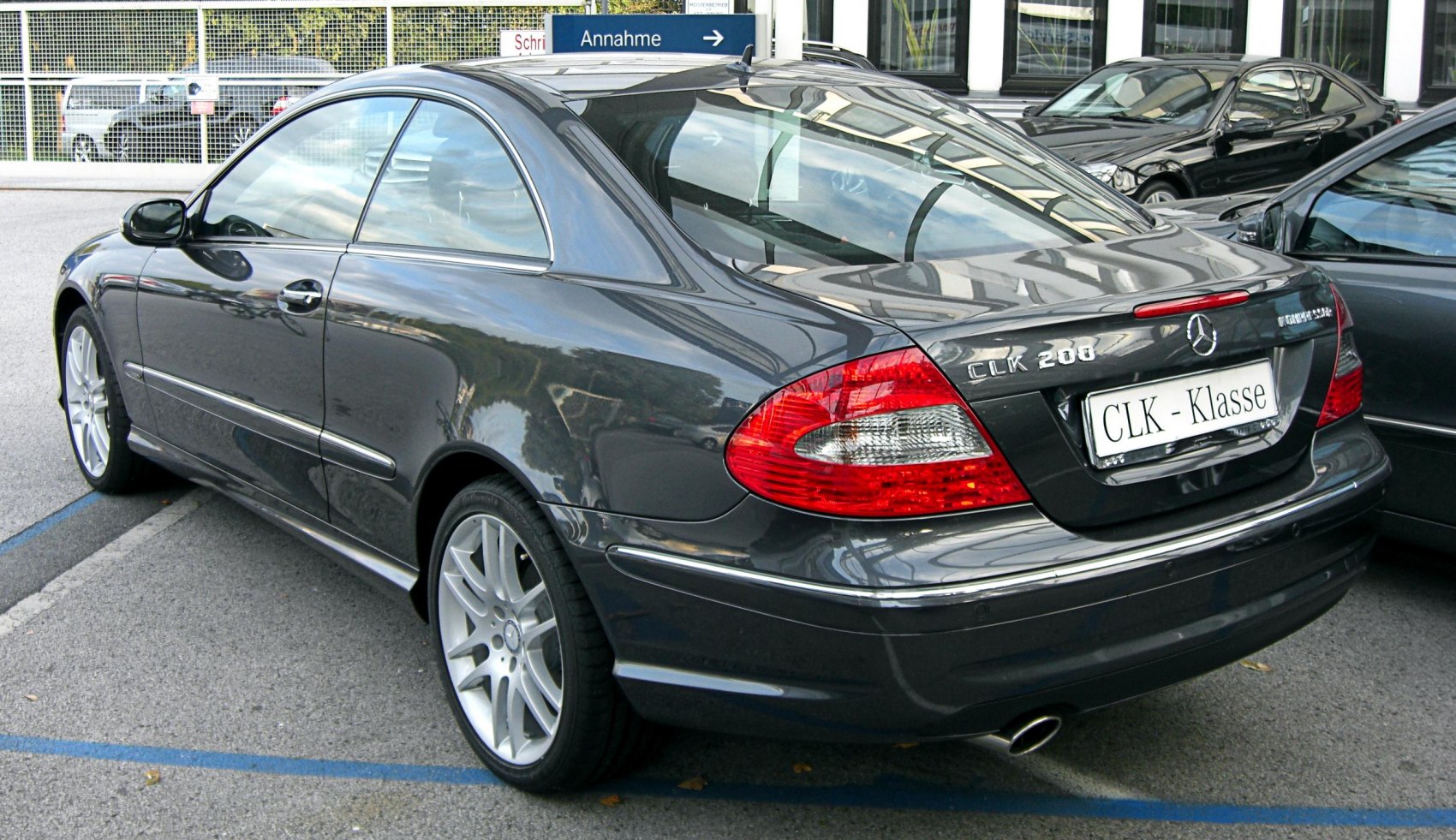 Sleek coupe rear and side profile with distinct taillights and alloy wheels