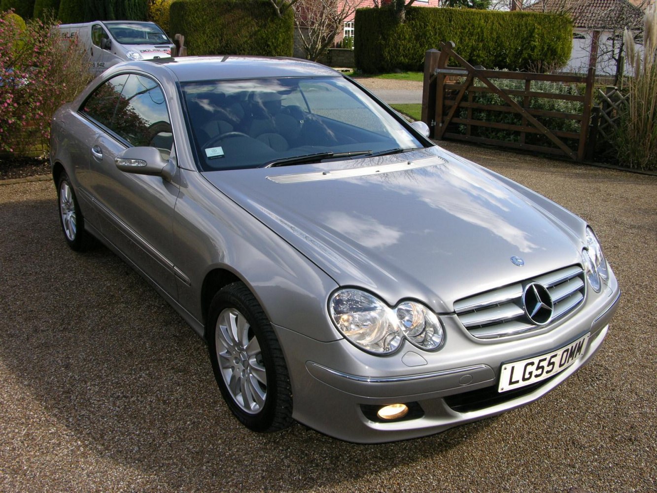 Dual round headlights and sleek coupe design with alloy wheels