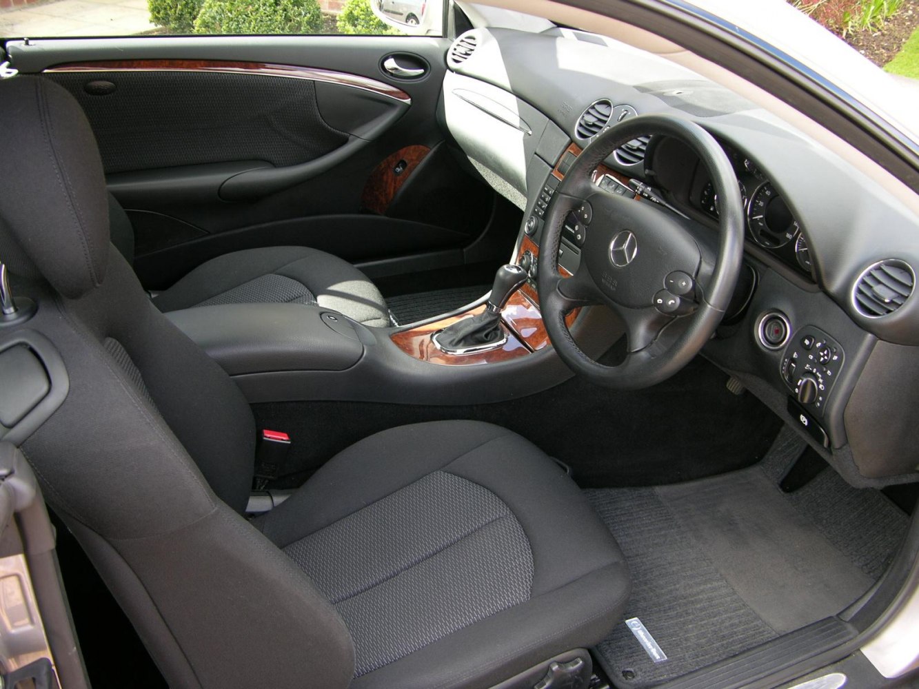 Black interior with wood trim and automatic gearshift