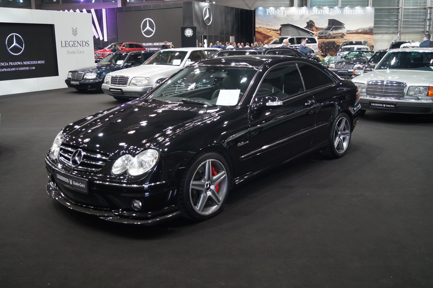 Black sporty coupe with AMG wheels and red brake calipers