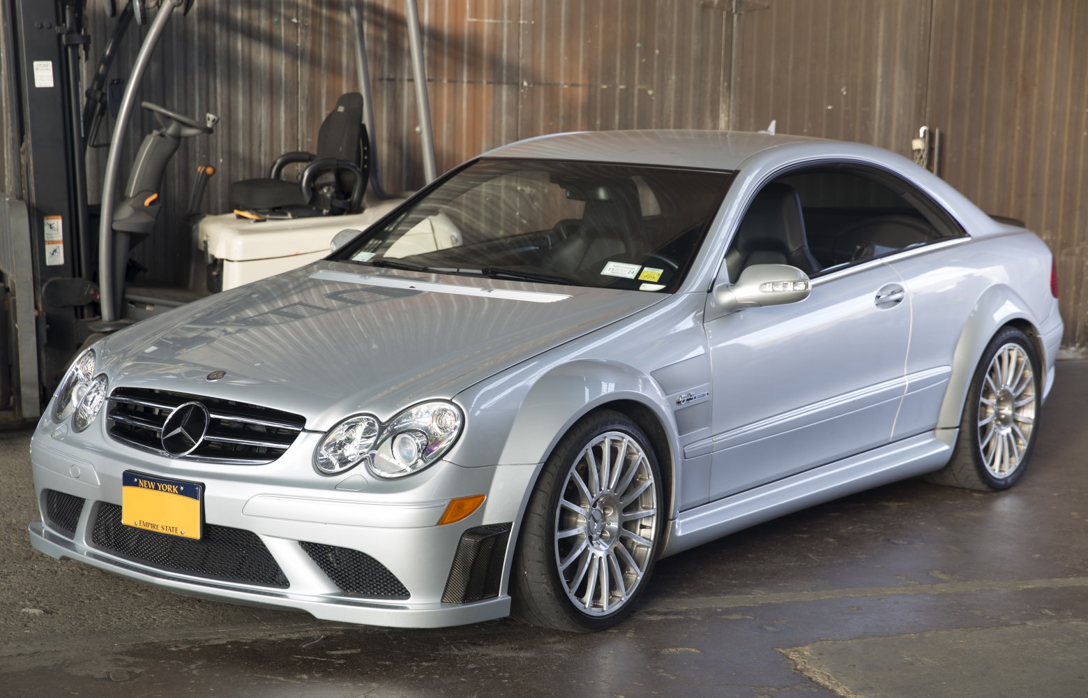 Silver coupe with quad headlamps and sporty alloy wheels