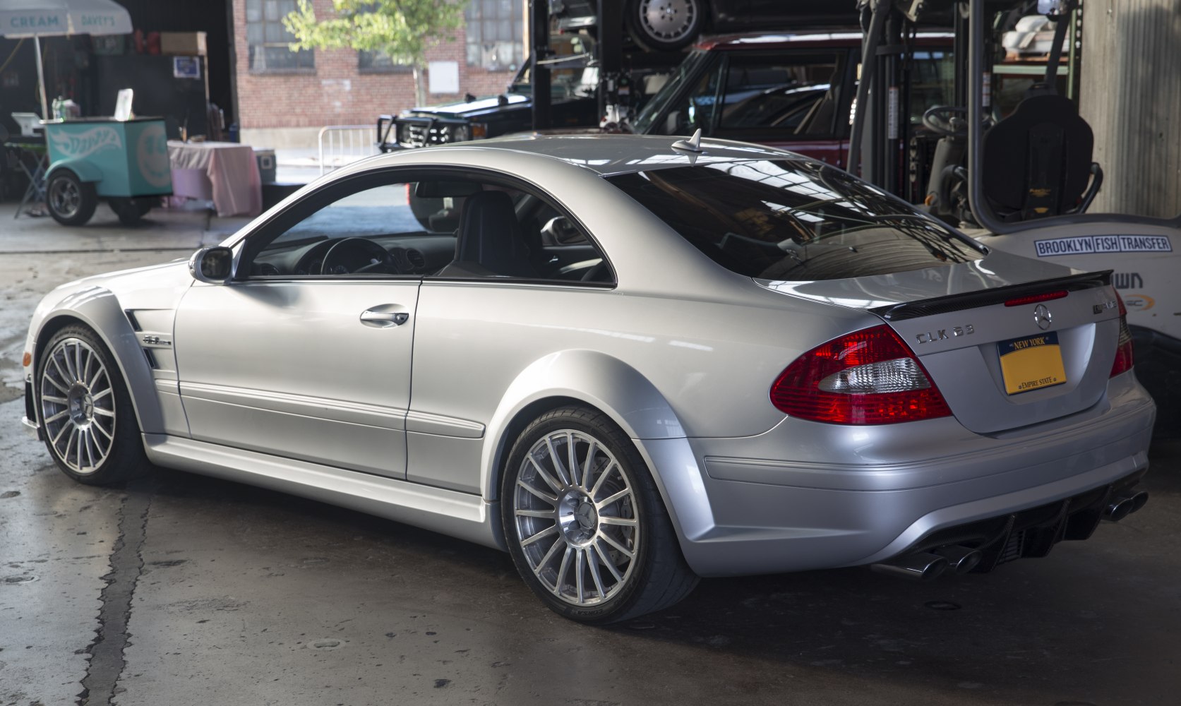 Rear side profile with sporty wheels and quad exhaust
