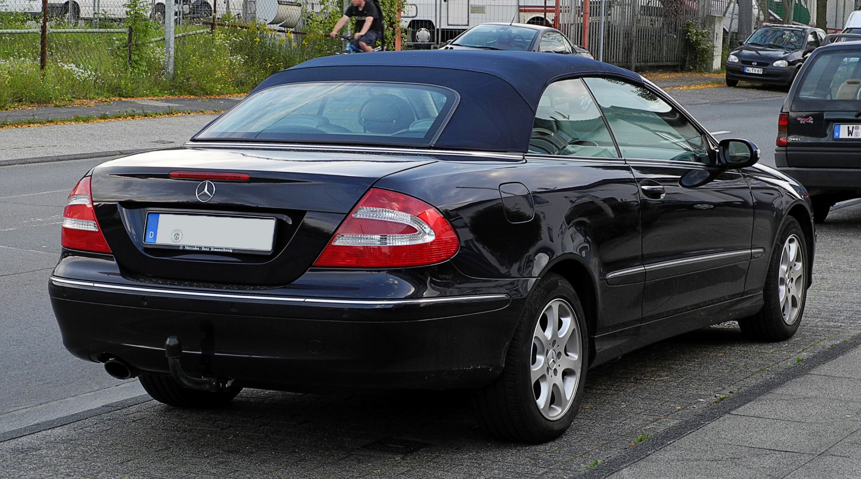 Rear view of convertible with soft top and distinctive taillights