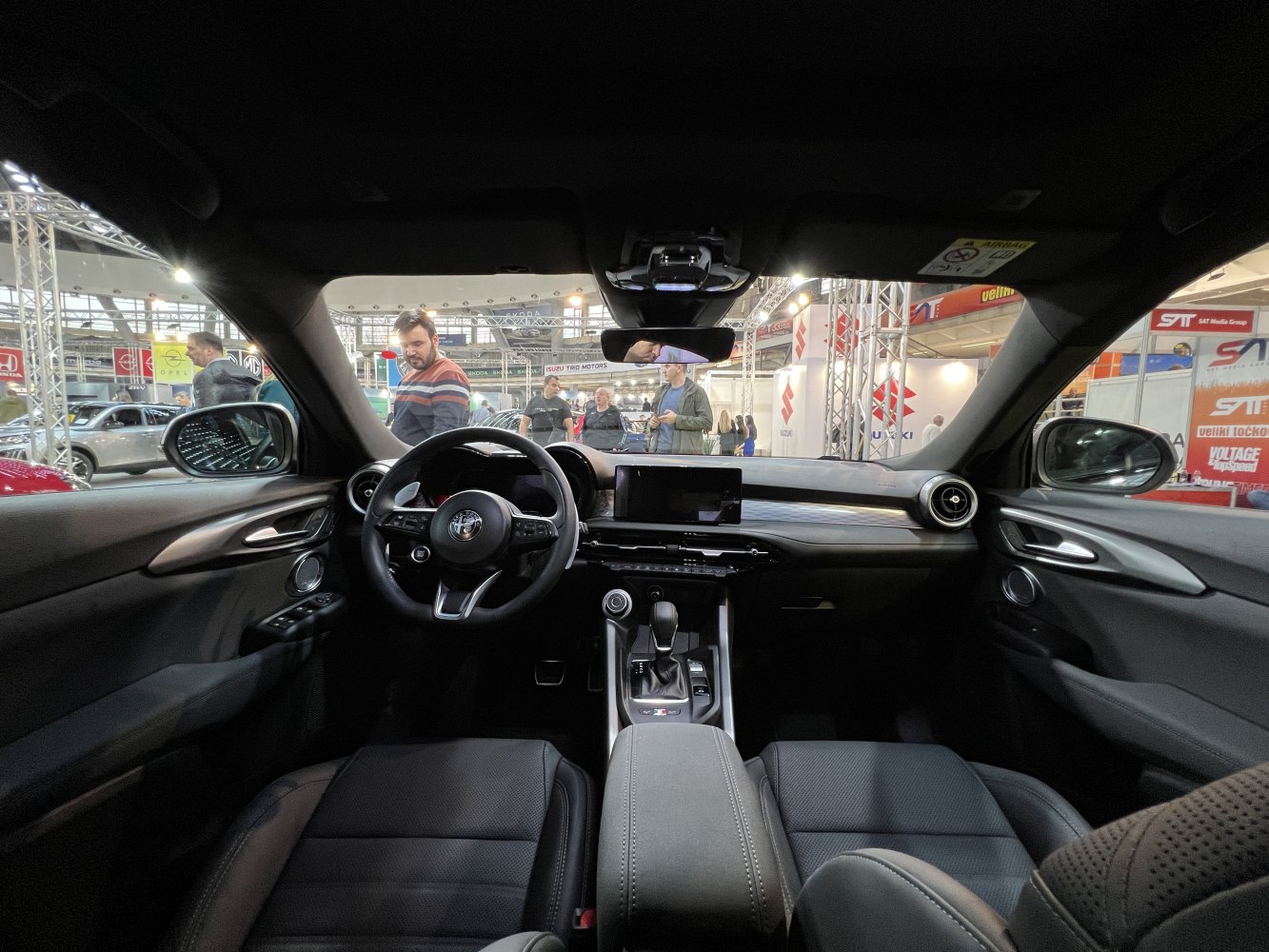 Modern dashboard with digital display, multifunction steering wheel, and control console